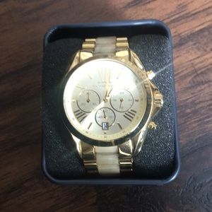 Gold Michael Kors watch.
